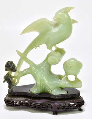 Lot 1206 - A Chinese green hardstone carving of birds...