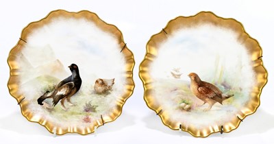 Lot 736 - ROYAL DOULTON; a pair of shaped gilt...