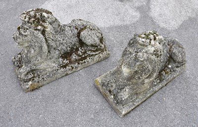 Lot 1515 - A pair of reconstituted stone lions on...