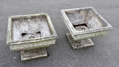 Lot 1517 - A pair of reconstituted stone garden planters...