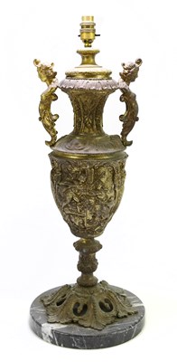 Lot 1501 - A large decorative gilt twin handled lamp...