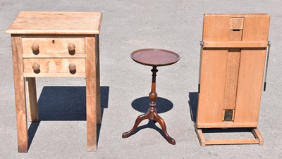 Lot 1621 - A pine two drawer side table on block legs,...
