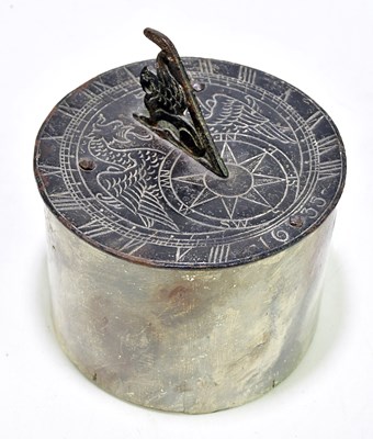 Lot 1136 - A cast iron sundial with pierced griffin...