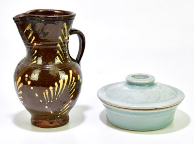 Lot 1321 - A 19th century treacle glazed slipware...