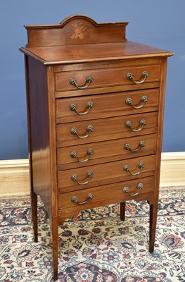 Lot 1625 - An Edwardian inlaid mahogany music cabinet...