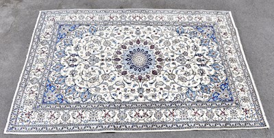 Lot 1505 - A cream fine Keshan carpet, 307 x 200cm.