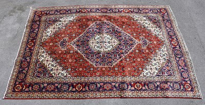 Lot 1503 - A red ground Tebriz carpet, 296 x 199cm.