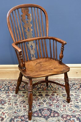 Lot 1527 - An early 19th century yew wood tall back...