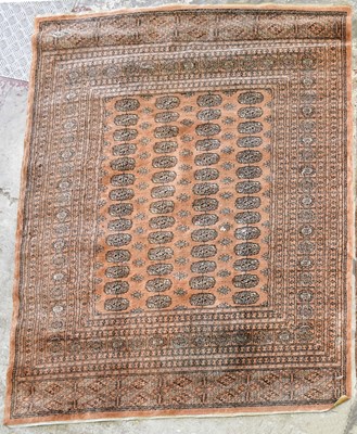 Lot 1513 - A orange ground Bokhara style rug, 139 x 182cm.