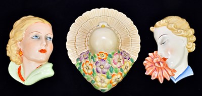 Lot 1440 - ROYAL DUX; a wall mask of woman smelling a...