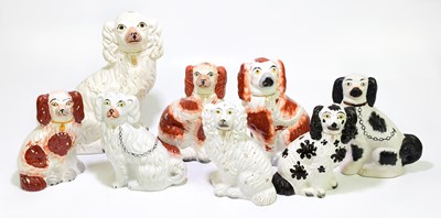 Lot 1275 - A group of eight Staffordshire porcelain dogs,...