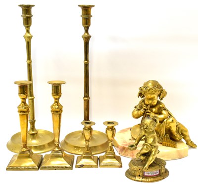 Lot 190 - A large brass cherub playing panpipes and drum,...