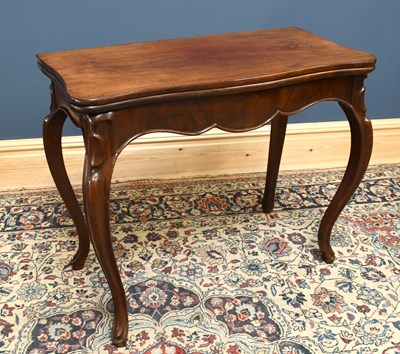 Lot 1606 - A 19th century mahogany fold over tea table,...