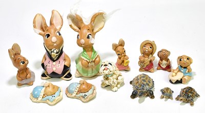 Lot 1278 - PENDELFIN; a group of nine rabbits and a dog,...