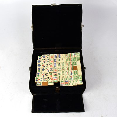 Lot 342 - An early 20th century leather cased Mah-Jong...
