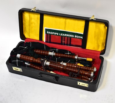 Lot 568 - A contemporary cased set of turned wooden...