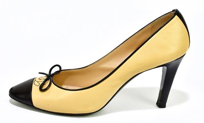 Lot 783 - CHANEL; a pair of classic cream leather heeled...