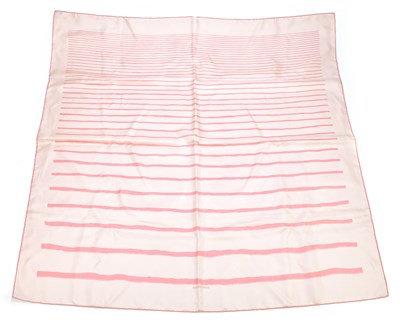 Lot 654 - HERMÈS; a powder pink 100% silk scarf with...