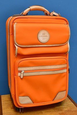 Lot 597 - LANCEL; an orange canvas cabin size travel bag...