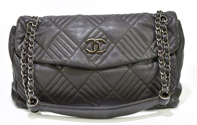 Lot 656 - CHANEL; a rare aubergine lambskin leather...