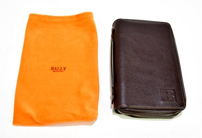 Lot 634 - BALLY; a brown embossed leather travel wallet...