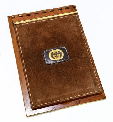 Lot 600 - GUCCI; a vintage walnut desk pad with suede...
