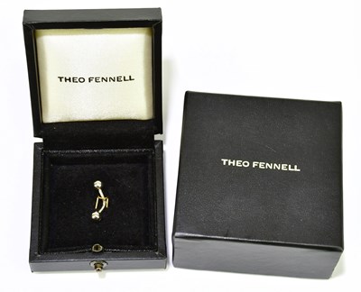Lot 589 - THEO FENNELL; an 18ct white gold belly bar...