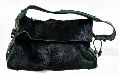 Lot 683 - VIA LA MODA; a green springbok hide and...