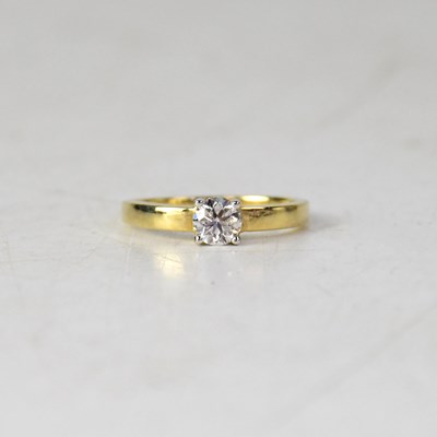 Lot 983 - A 9ct yellow gold diamond solitaire ring, the...