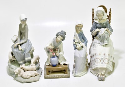 Lot 1727 - LLADRO; four figures to include a seated...