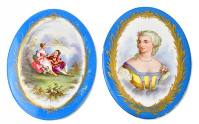 Lot 1650 - Two hand painted oval plaques, in the manner...
