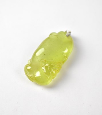 Lot 987 - A pale green ice jade pendant