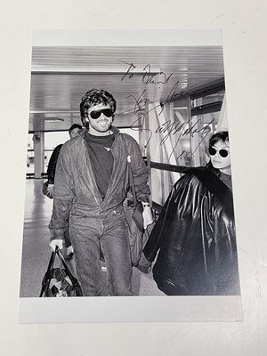 Lot 2100 - GEORGE MICHAEL; a black and white photograph...