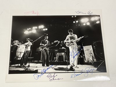 Lot 2101 - SANTANA; a black and white photograph bearing...