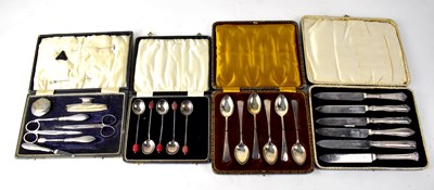 Lot 694 - A cased silver handled manicure set
