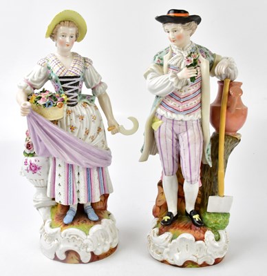 Lot 1721 - A pair of ceramic figures, the lady with a...