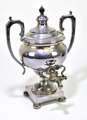 Lot 1014 - A 19th century silver plated twin handled tea...