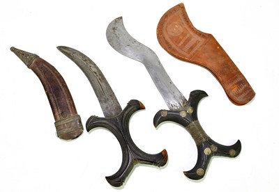 Lot 1116A - Two Sudanese daggers, each with carved wooden...