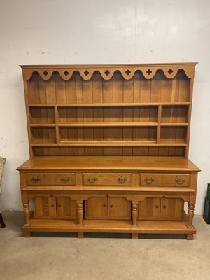 Lot 429 - A contemporary blonde oak dresser, the boarded...