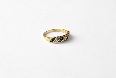 Lot 763 - A 9ct gold diamond and sapphire dress ring