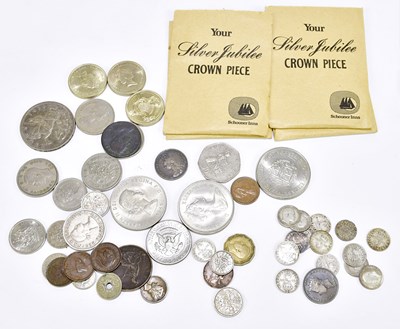 Lot 1476 - A small group of coins, including...