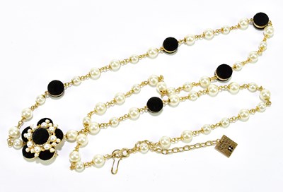 Lot 583 - EDWARD ACHOUR PARIS; a gold tone long metal...