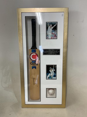 Lot 2324 - SHANE WARNE; a box framed cricket bat and ball,...