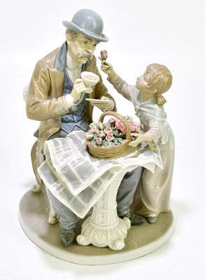 Lot 1726 - LLADRO; a figure group representing a seated...