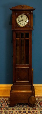 Lot 2285 - A 1920s oak longcase clock, with silvered dial...