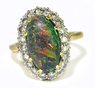 Lot 68 - A yellow metal black opal and diamond set ring,...