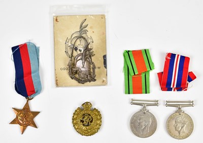 Lot 507 - Three WWII medals comprising the Defence Medal,...