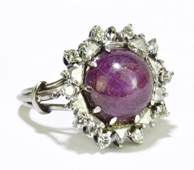 Lot 10 - A white metal star ruby and diamond set large...
