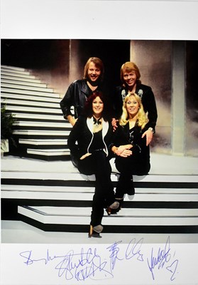 Lot 502 - ABBA; a promotional colour photograph bearing...