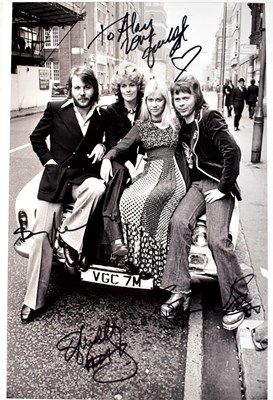 Lot 501 - ABBA; a black and white promotional photograph,...